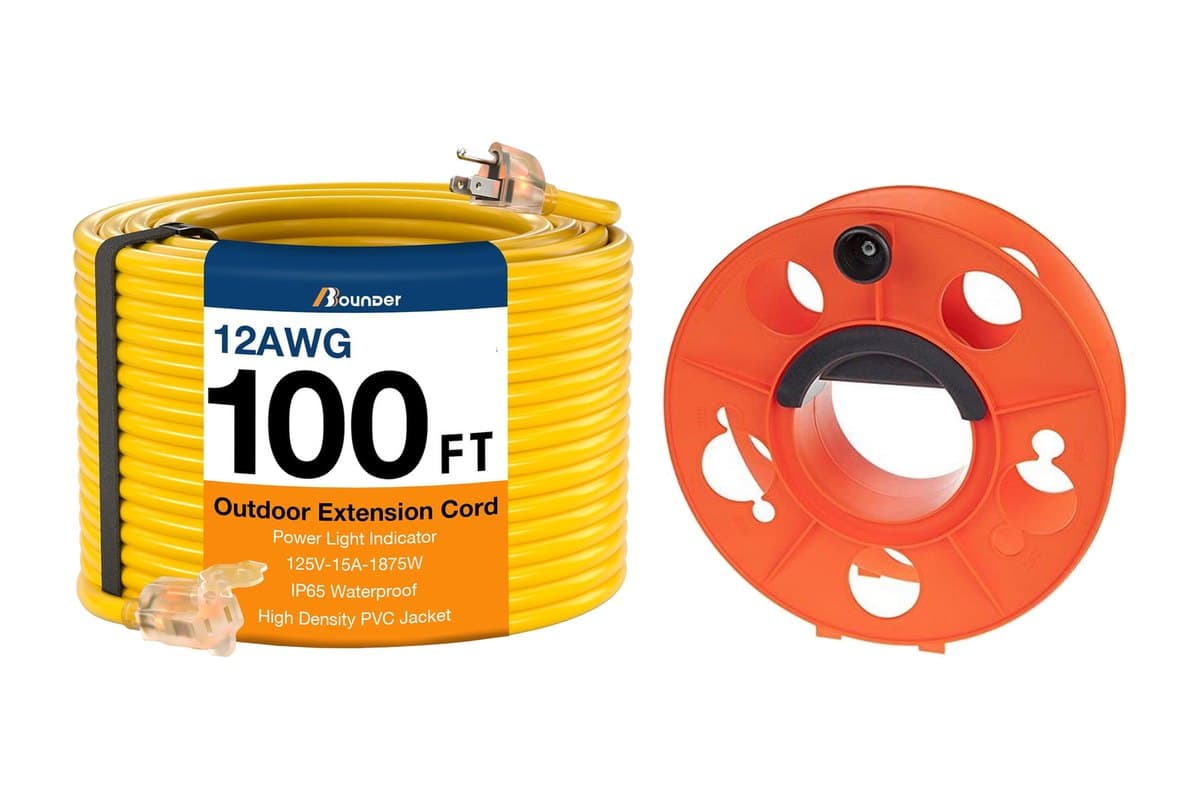 Coiled yellow 100-foot outdoor extension cord next to an orange cord reel